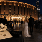 Celebrity couple walking toward a New York wedding event with media and fans