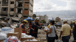 Rescue workers search damaged buildings after the Venezuela earthquake as aid response continues