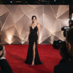 Celebrities arriving on a glamorous red carpet at a major entertainment event in 2026