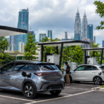 Electric vehicles using public charging stations in a modern Malaysian urban area
