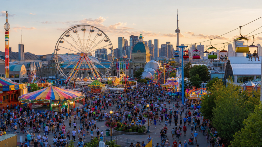 Crowds enjoying midway rides and attractions at the Canadian National Exhibition in Toronto.